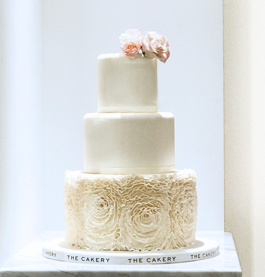 Wedding cake with ruffle icing | Honestweddingadvice.com