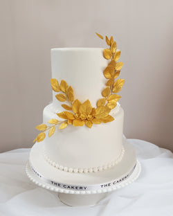 White Wedding Cake with Gold Leaves