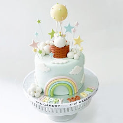 Baby unicorn hot air balloon cake